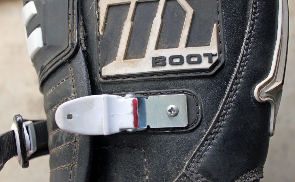 GENTLY FILING A SMALL AMOUNT OF MATERIAL OFF THE AREA MARKED IN RED GREATLY IMPROVED THE BUCKLE ACTION OF THE m1.2